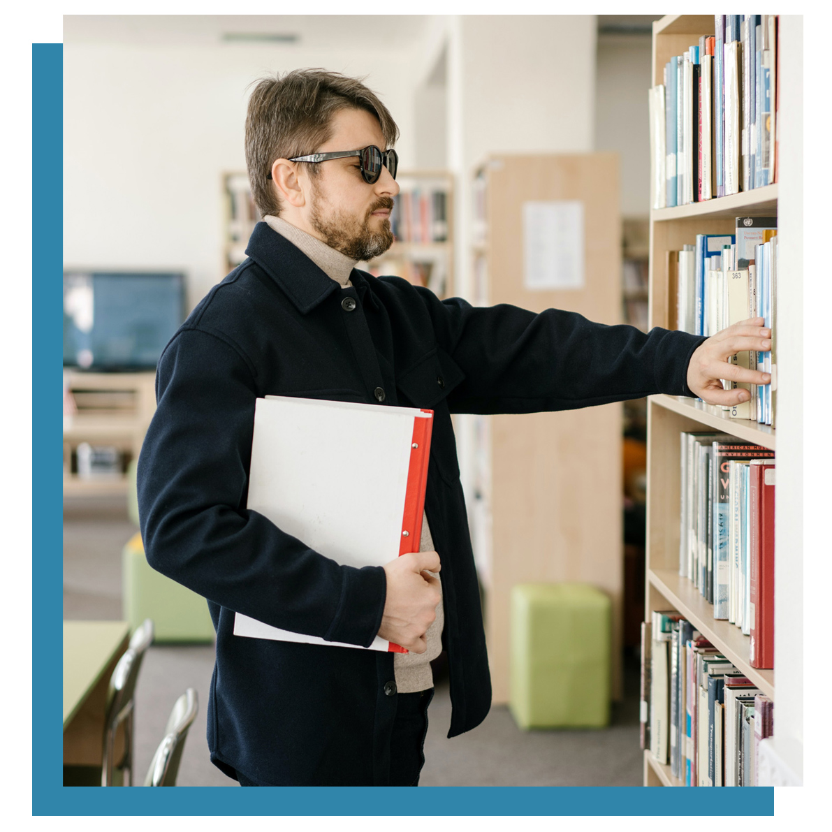 Blind man putting book back in library